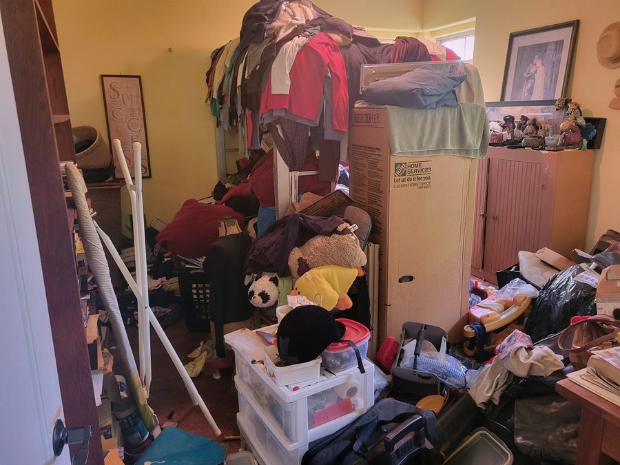 Bedroom in a Lansing hoarder house before cleanout and renovation